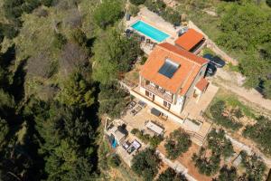 an aerial view of a house with a swimming pool at Casa Malinas in Stanići +105 photos