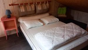 Ένα ή περισσότερα κρεβάτια σε δωμάτιο στο La Patelle