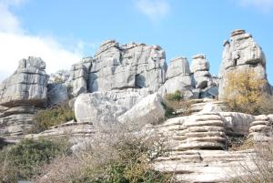 a rocky mountain with a blue sky in the background at Hostal R-Conecta in Cuevas de San Marcos