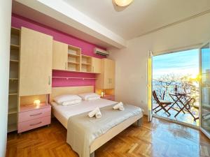 Postel nebo postele na pokoji v ubytování Apartments Kiro