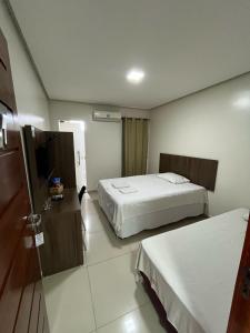 Katil atau katil-katil dalam bilik di Seller Hotel