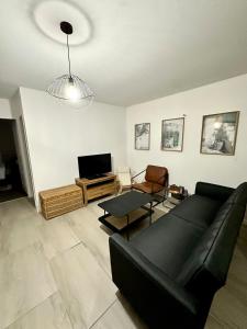 Μια τηλεόραση ή/και κέντρο ψυχαγωγίας στο Appartement cosy à Soissons