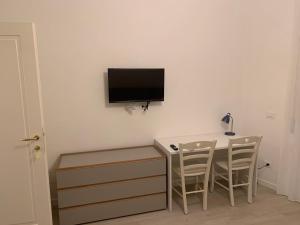 TV a/nebo společenská místnost v ubytování Dimoraalporto