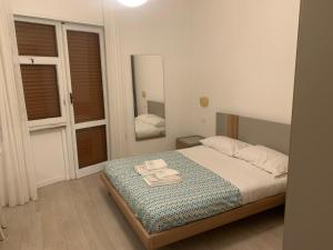Postel nebo postele na pokoji v ubytování Dimoraalporto