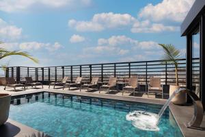 a swimming pool on the roof of a hotel at Courtyard by Marriott Casablanca Downtown in Casablanca