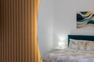 ADAMAS apartment , rooms and suite客房内的一张或多张床位