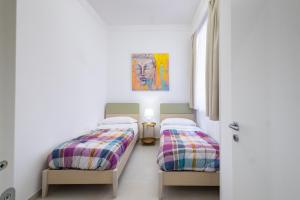 ADAMAS apartment , rooms and suite客房内的一张或多张床位