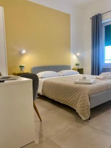 Postel nebo postele na pokoji v ubytování ISTAI Cagliari City Center Rooms + 24 fotografií