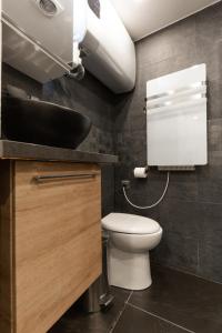 a bathroom with a toilet and a sink at Saint Michel in Paris