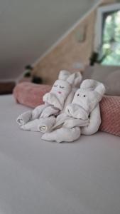 a group of towels sitting on top of a bed at Villa Melani **** in Oriovac