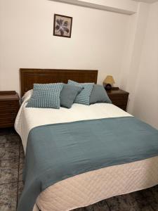 Postel nebo postele na pokoji v ubytování Hostal San José Naval