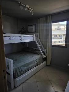 Ένα ή περισσότερα κρεβάτια σε δωμάτιο στο Quarto em cobertura duplex com piscina e espaço ao ar livre +12 φωτογραφίες
