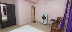 a room with a room with a air conditioner at Room in Banjara Hills in Hyderabad