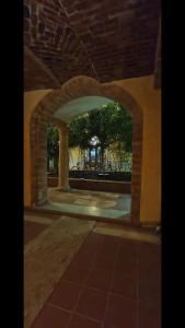 an archway in a building with a brick wall at Antica Dimora DE FERRERA - Alghero in Alghero