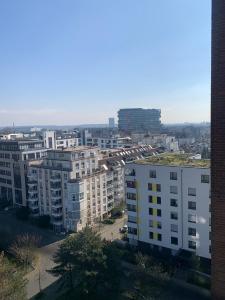 a view of a city with tall buildings at Business Messe Apartment & Wellness Spa in Düsseldorf +8 photos