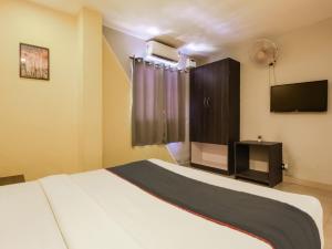 Ένα ή περισσότερα κρεβάτια σε δωμάτιο στο Hotel O MAP INN