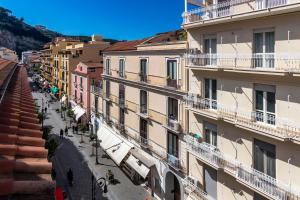 a view of a street in a city with buildings at Mansarda del Corso in Sorrento