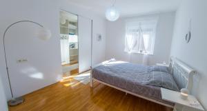 Ένα ή περισσότερα κρεβάτια σε δωμάτιο στο Oasis Luxe Apartment