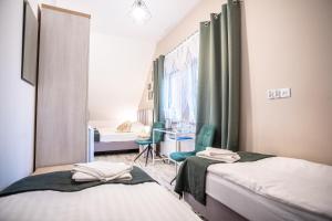 Posteľ alebo postele v izbe v ubytovaní Azymut