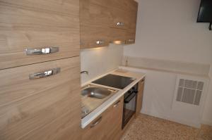 Kuchyň nebo kuchyňský kout v ubytování Palazzo Maggiore Suite B