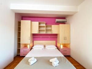 Postel nebo postele na pokoji v ubytování Apartments Kiro