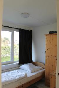 En eller flere senge i et værelse på Malou