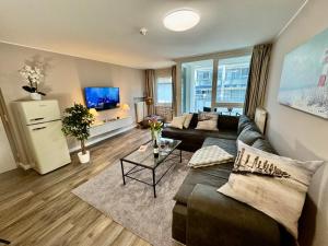 TV a/nebo společenská místnost v ubytování Ferienwohnung Nr 124 Sehnsucht-Zingst