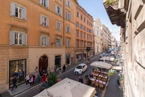 a city street with buildings and people walking on the street at Sistina Boutique Guest House in Rome