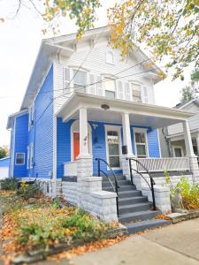 a blue house with a red door at The Wilderness, Near CP & SF, W&D, Pet OK in Sandusky