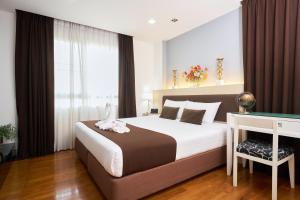 Postel nebo postele na pokoji v ubytování Shine Aparthotels Sukhumvit Thonglor