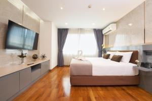 Postel nebo postele na pokoji v ubytování Shine Aparthotels Sukhumvit Thonglor