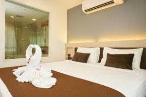 Postel nebo postele na pokoji v ubytování Shine Aparthotels Sukhumvit Thonglor