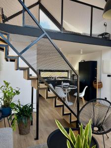 a staircase in a living room with plants at Wczasowy Loft Sominy in Sominy +44 photos