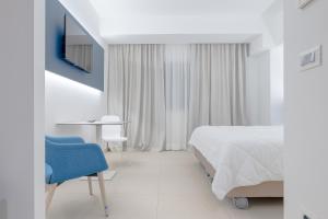 Postel nebo postele na pokoji v ubytování LHI Healthy Hotel Lecce