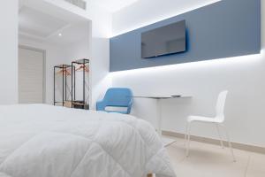 TV a/nebo společenská místnost v ubytování LHI Healthy Hotel Lecce