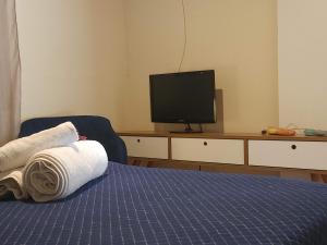 Et tv og/eller underholdning på Antonietta Hospedagem e Eventos - Conforto em pleno mar de morros de Cunha