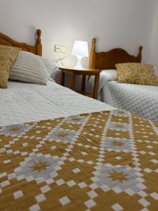 Postel nebo postele na pokoji v ubytování Hostal San José Naval
