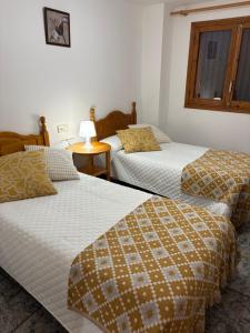 Postel nebo postele na pokoji v ubytování Hostal San José Naval