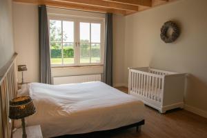Postel nebo postele na pokoji v ubytování Wertemerhoeve Vakantiewoningen