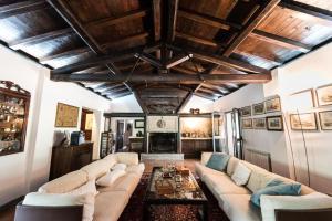 a living room with a couch and a fireplace at Tenuta Torre di Pian Castagno in Sutri