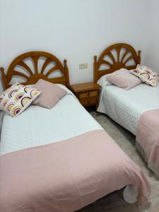 Postel nebo postele na pokoji v ubytování Hostal San José Naval