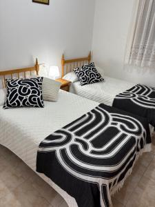 Postel nebo postele na pokoji v ubytování Hostal San José Naval