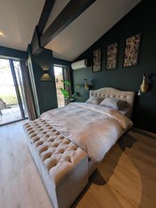 Postel nebo postele na pokoji v ubytování Bed and Breakfast, de Heidedijk + 23 fotografií