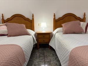Postel nebo postele na pokoji v ubytování Hostal San José Naval
