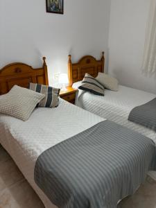 Postel nebo postele na pokoji v ubytování Hostal San José Naval