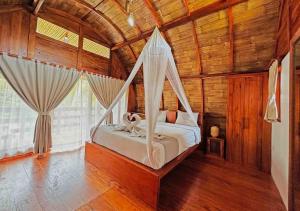Postel nebo postele na pokoji v ubytování Lagoona Beach Bungalows - Eco Stay + 37 fotografií