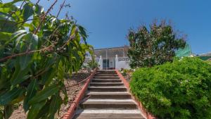 a set of stairs leading up to a house at Casa Candiles Torrox by Ruralidays in Torrox