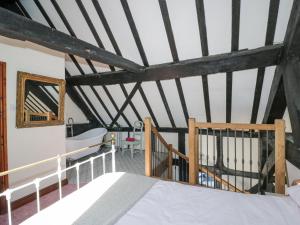 Ένα ή περισσότερα κρεβάτια σε δωμάτιο στο Wyre Court Cottage