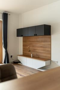 a living room with a couch and a table at Andrea 's 4 seasons in Albrechtice v Jizerských horách