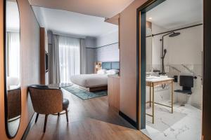 Postel nebo postele na pokoji v ubytování Brussels Marriott Hotel Grand Place